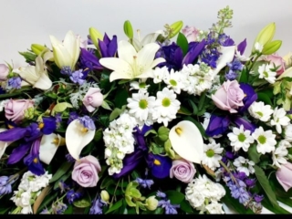 Traduational casket spray – blue and purple tones
